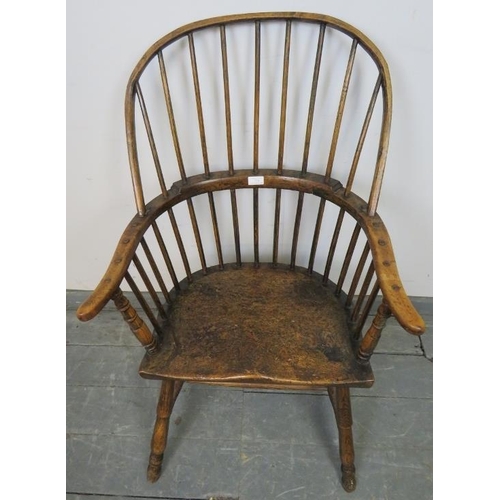 729 - A good 18th century elm Windsor hoop back chair, on turned canted supports with an ‘H’ stretcher. c1... 