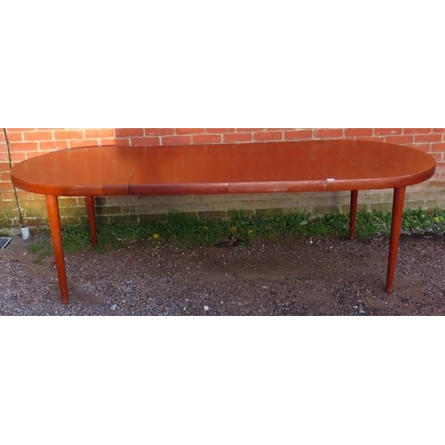 731 - A mid-century Danish teak oval draw-leaf extending dining table, with two additional leaves, on tape... 