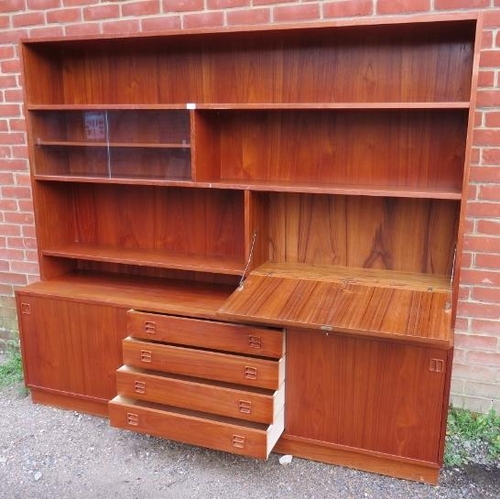 732 - A mid-century Danish teak wall unit by Sejling Skabe, the top section with fall front bureau and fit... 