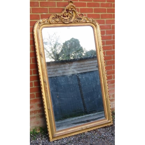 733 - A large 19th century French over mantle mirror, in an ornate gilt gesso frame with beaded edging and... 