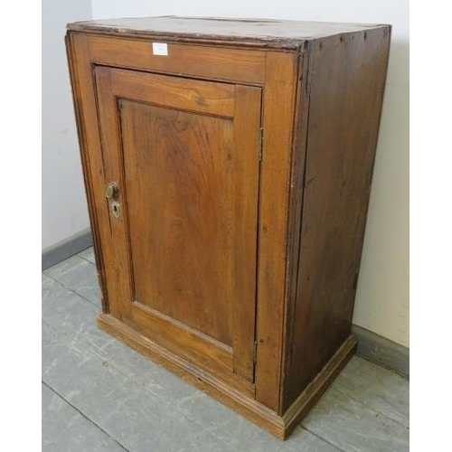 740 - An 18th century provincial elm freestanding cupboard, with fitted shelf, on a plinth base.  
Conditi... 