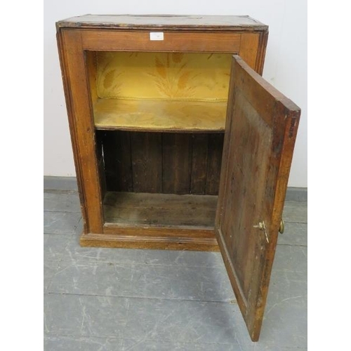 740 - An 18th century provincial elm freestanding cupboard, with fitted shelf, on a plinth base.  
Conditi... 