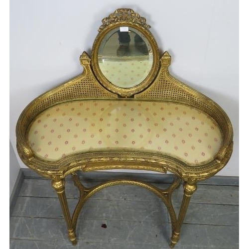 742 - A vintage French giltwood dressing table, the double skin bergère gallery supporting a bevelled oval... 