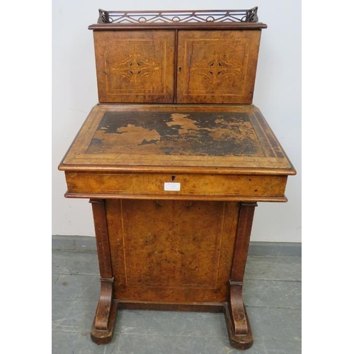 753 - A Victorian burr walnut Davenport, the stationary compartment upper gallery featuring marquetry inla... 