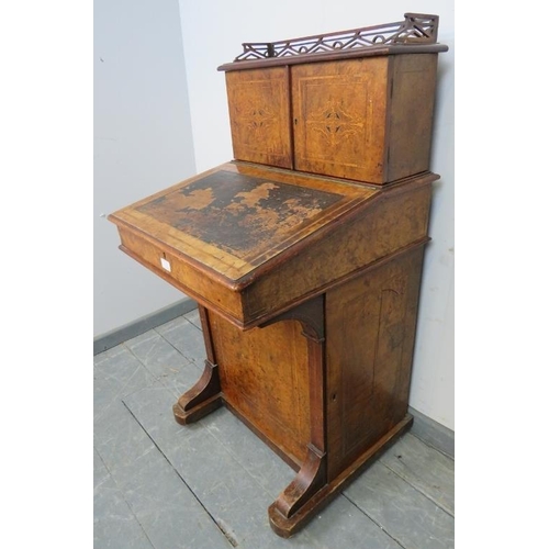 753 - A Victorian burr walnut Davenport, the stationary compartment upper gallery featuring marquetry inla... 