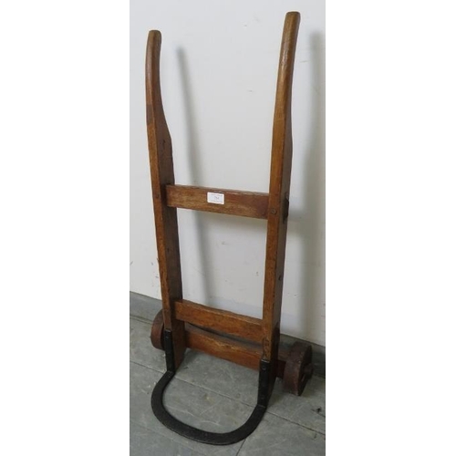 755 - An antique oak miniature sack-barrow, on wooden wheels. 
Condition report: Signs of historic woodwor... 