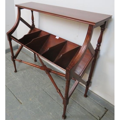 760 - An Edwardian mahogany book trough, having five divided compartments, on faux bamboo tapering support... 