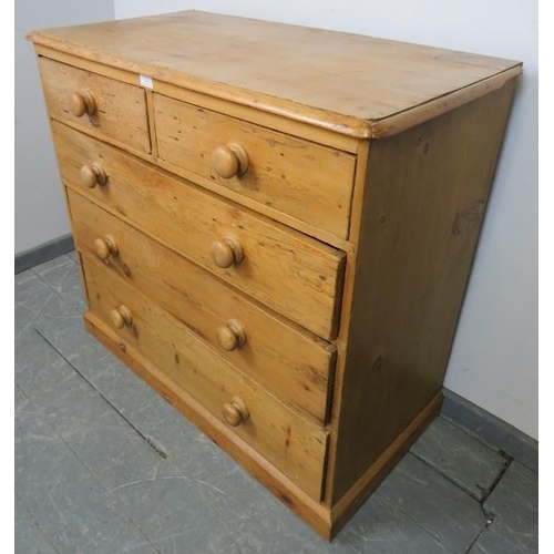 764 - A Victorian stripped pine chest of two short over three long graduated drawers with turned wooden kn... 