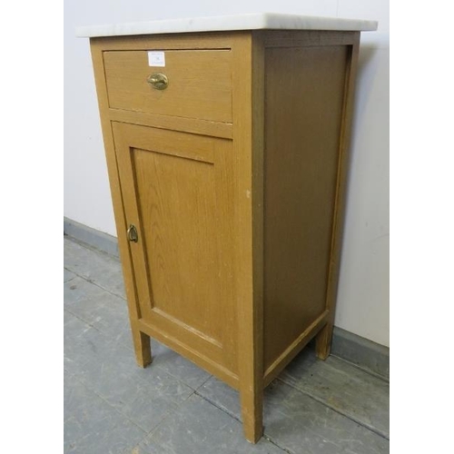 766 - An antique Continental light oak marble topped bedside cabinet, with single drawer and cupboard unde... 