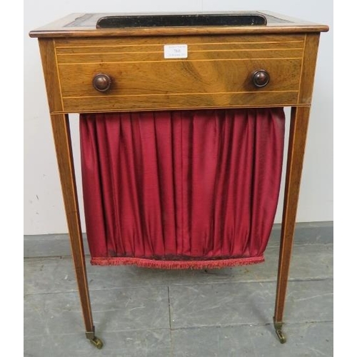 768 - A Regency Period rosewood worktable, strung with satinwood, the rising bookrest top with inset burgu... 