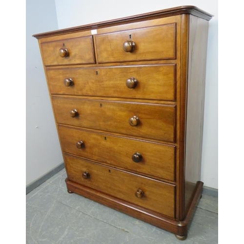 772 - A Victorian mahogany straight front chest of two short over four long graduated drawers with turned ... 