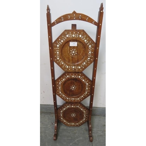 780 - An antique hardwood Hoshiapur three tier folding cake stand, featuring bone inlay in the Moorish tas... 