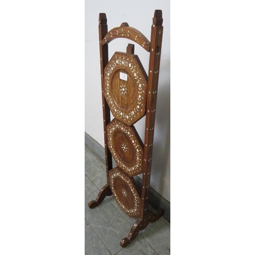 780 - An antique hardwood Hoshiapur three tier folding cake stand, featuring bone inlay in the Moorish tas... 