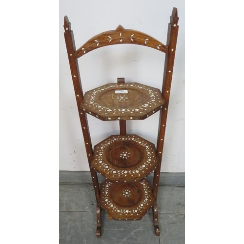 780 - An antique hardwood Hoshiapur three tier folding cake stand, featuring bone inlay in the Moorish tas... 