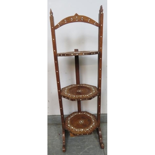 780 - An antique hardwood Hoshiapur three tier folding cake stand, featuring bone inlay in the Moorish tas... 