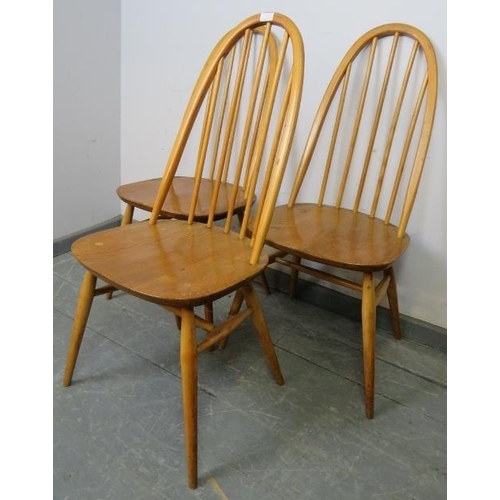 785 - Three mid-century blond elm and beech Windsor Quaker dining chairs by Ercol, on canted supports with... 