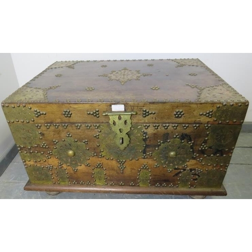 790 - A vintage hardwood Zanzibar chest of small proportions, with hand hammered pierced brass decoration ... 