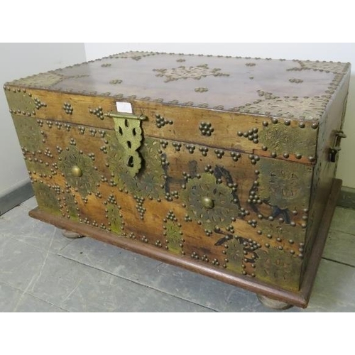 790 - A vintage hardwood Zanzibar chest of small proportions, with hand hammered pierced brass decoration ... 