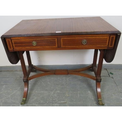 794 - A good quality Regency style sapele mahogany sofa table made by Kelly of Southern Rhodesia, with ree... 