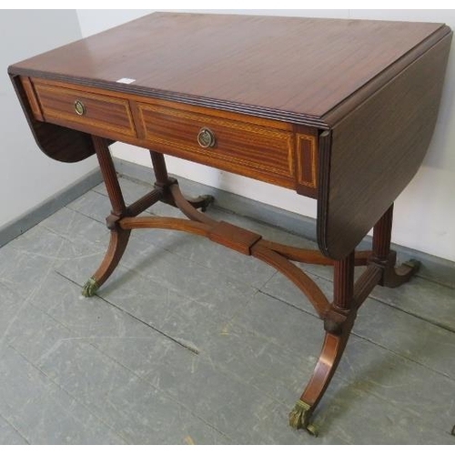 794 - A good quality Regency style sapele mahogany sofa table made by Kelly of Southern Rhodesia, with ree... 