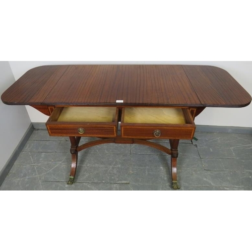 794 - A good quality Regency style sapele mahogany sofa table made by Kelly of Southern Rhodesia, with ree... 