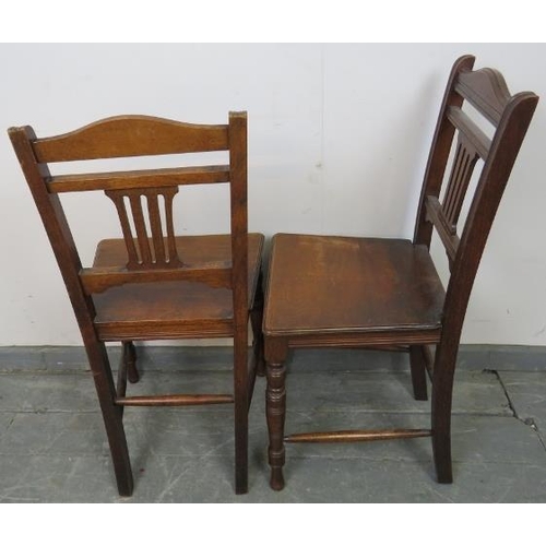 795 - A pair of Edwardian hall chairs with pierced back splats, on tapering turned supports with side stre... 