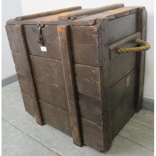 799 - A vintage oak luggage chest with internal candle box, cast iron fittings and rope handles to either ... 