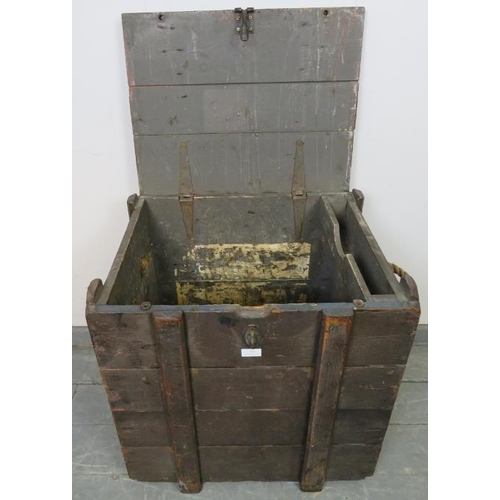 799 - A vintage oak luggage chest with internal candle box, cast iron fittings and rope handles to either ... 