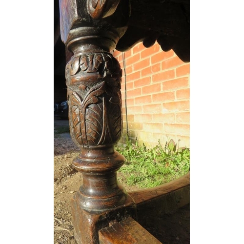 801 - An Elizabethan and later oak refectory table of exceptional colour and patina, the planked top with ... 