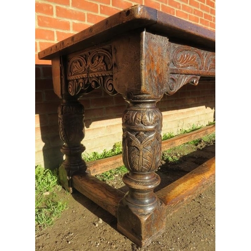 801 - An Elizabethan and later oak refectory table of exceptional colour and patina, the planked top with ... 