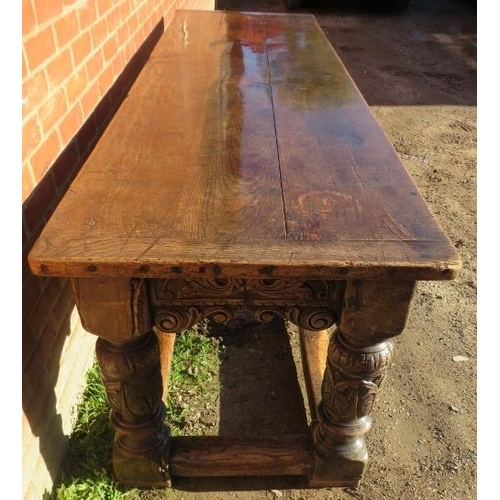 801 - An Elizabethan and later oak refectory table of exceptional colour and patina, the planked top with ... 