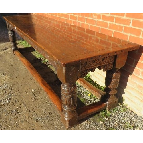 801 - An Elizabethan and later oak refectory table of exceptional colour and patina, the planked top with ... 