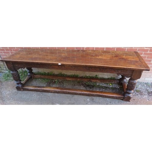 801 - An Elizabethan and later oak refectory table of exceptional colour and patina, the planked top with ... 