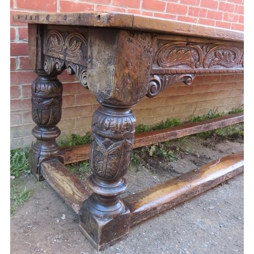 801 - An Elizabethan and later oak refectory table of exceptional colour and patina, the planked top with ... 