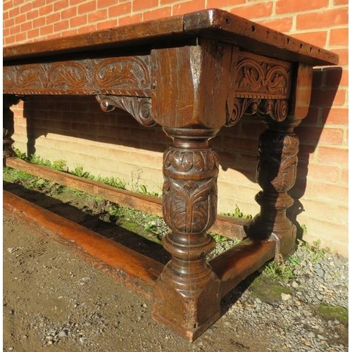 801 - An Elizabethan and later oak refectory table of exceptional colour and patina, the planked top with ... 