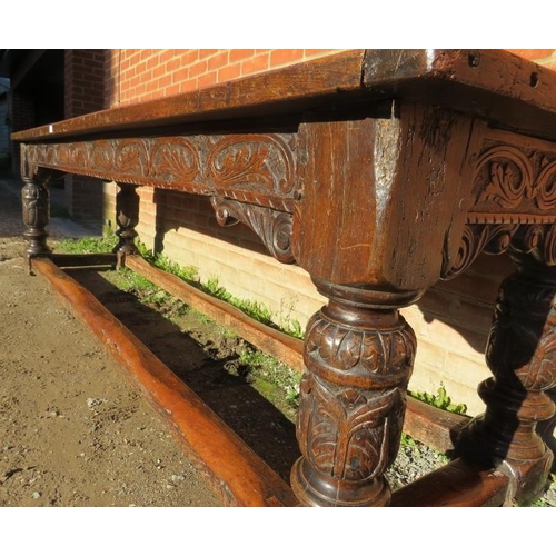 801 - An Elizabethan and later oak refectory table of exceptional colour and patina, the planked top with ... 