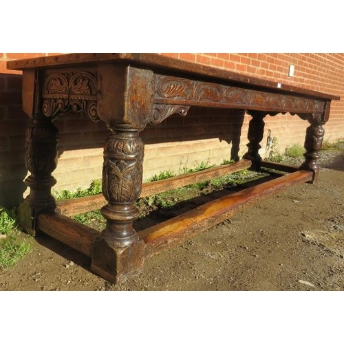 801 - An Elizabethan and later oak refectory table of exceptional colour and patina, the planked top with ... 