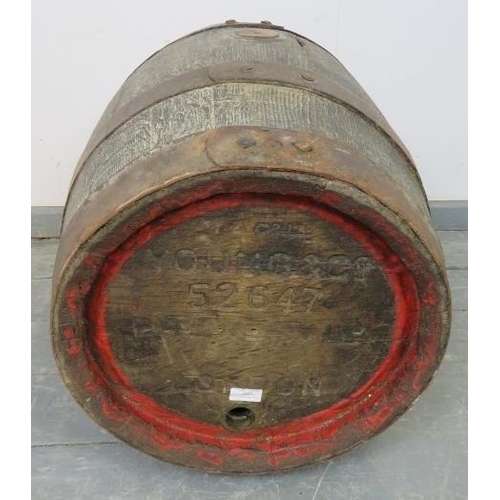 802 - An antique oak coopered beer barrel, formerly of Young & Co, London. 
Condition report: Tap is missi... 