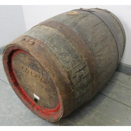 802 - An antique oak coopered beer barrel, formerly of Young & Co, London. 
Condition report: Tap is missi... 