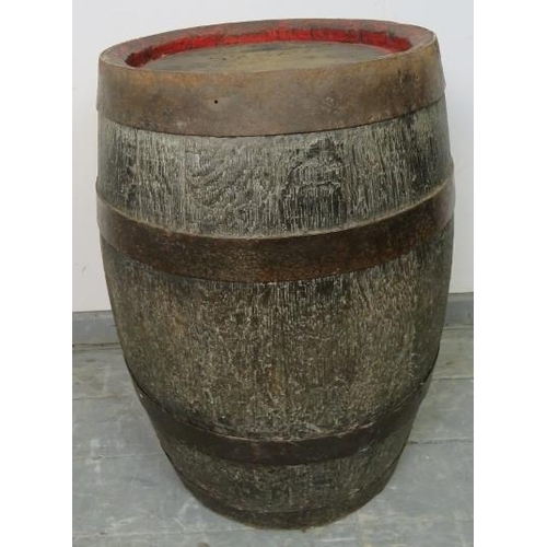 802 - An antique oak coopered beer barrel, formerly of Young & Co, London. 
Condition report: Tap is missi... 