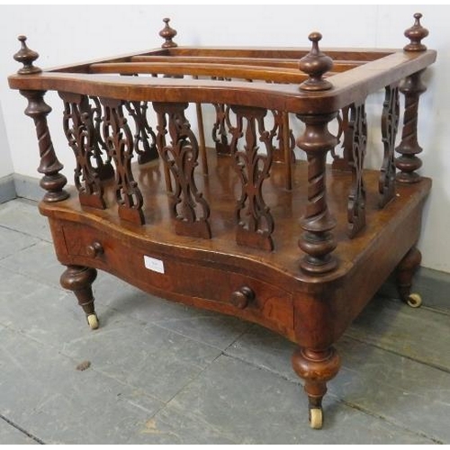 809 - A Victorian figured walnut serpentine front Canterbury, featuring carved and pierced uprights and tu... 