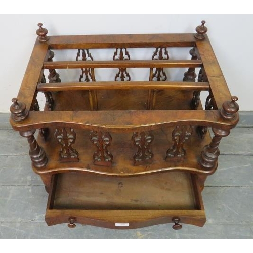 809 - A Victorian figured walnut serpentine front Canterbury, featuring carved and pierced uprights and tu... 