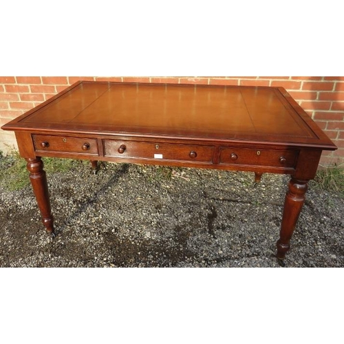 810 - A large Victorian mahogany writing desk, with inset gilt tooled tan leather writing surface, housing... 