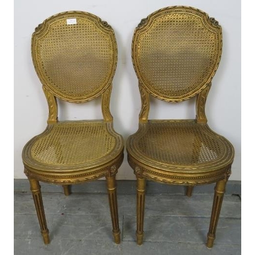 811 - A pair of vintage French giltwood opera seats with bergère back and seat panels, featuring carved fo... 