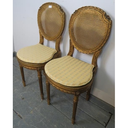 811 - A pair of vintage French giltwood opera seats with bergère back and seat panels, featuring carved fo... 