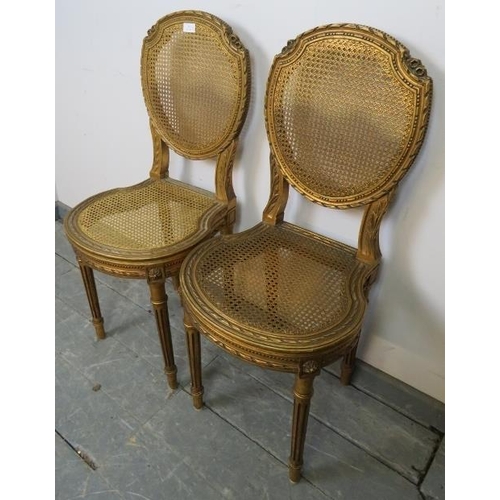 811 - A pair of vintage French giltwood opera seats with bergère back and seat panels, featuring carved fo... 