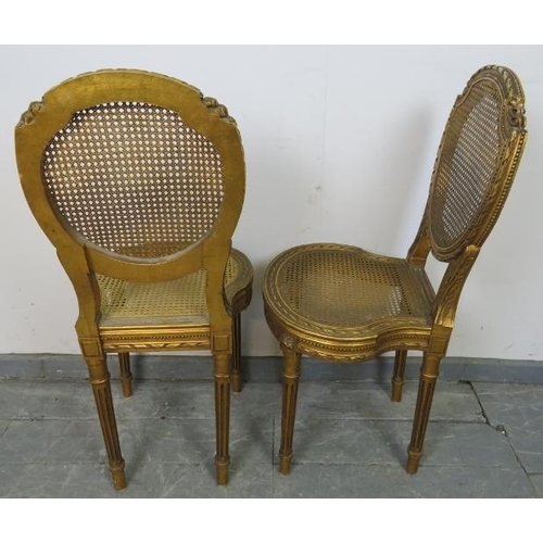 811 - A pair of vintage French giltwood opera seats with bergère back and seat panels, featuring carved fo... 