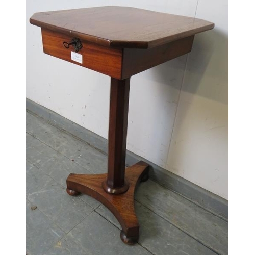 814 - A Victorian walnut pedestal work table, the rising lid opening onto a loose tray with divided compar... 