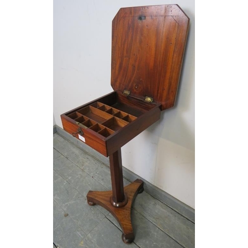 814 - A Victorian walnut pedestal work table, the rising lid opening onto a loose tray with divided compar... 