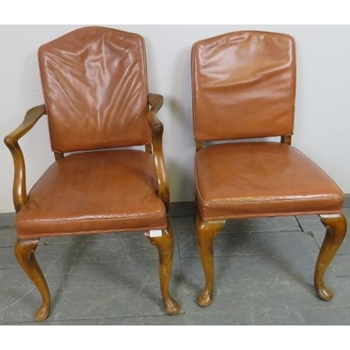 815 - A pair of antique walnut His and Hers desk chairs, one a carver, upholstered in distressed tan leath... 